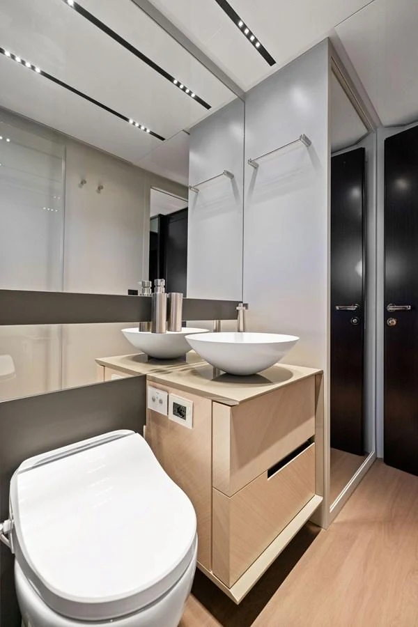 The yacht's bathroom features modern fixtures and a sleek design. aboard CAFFEINE Yacht for Sale