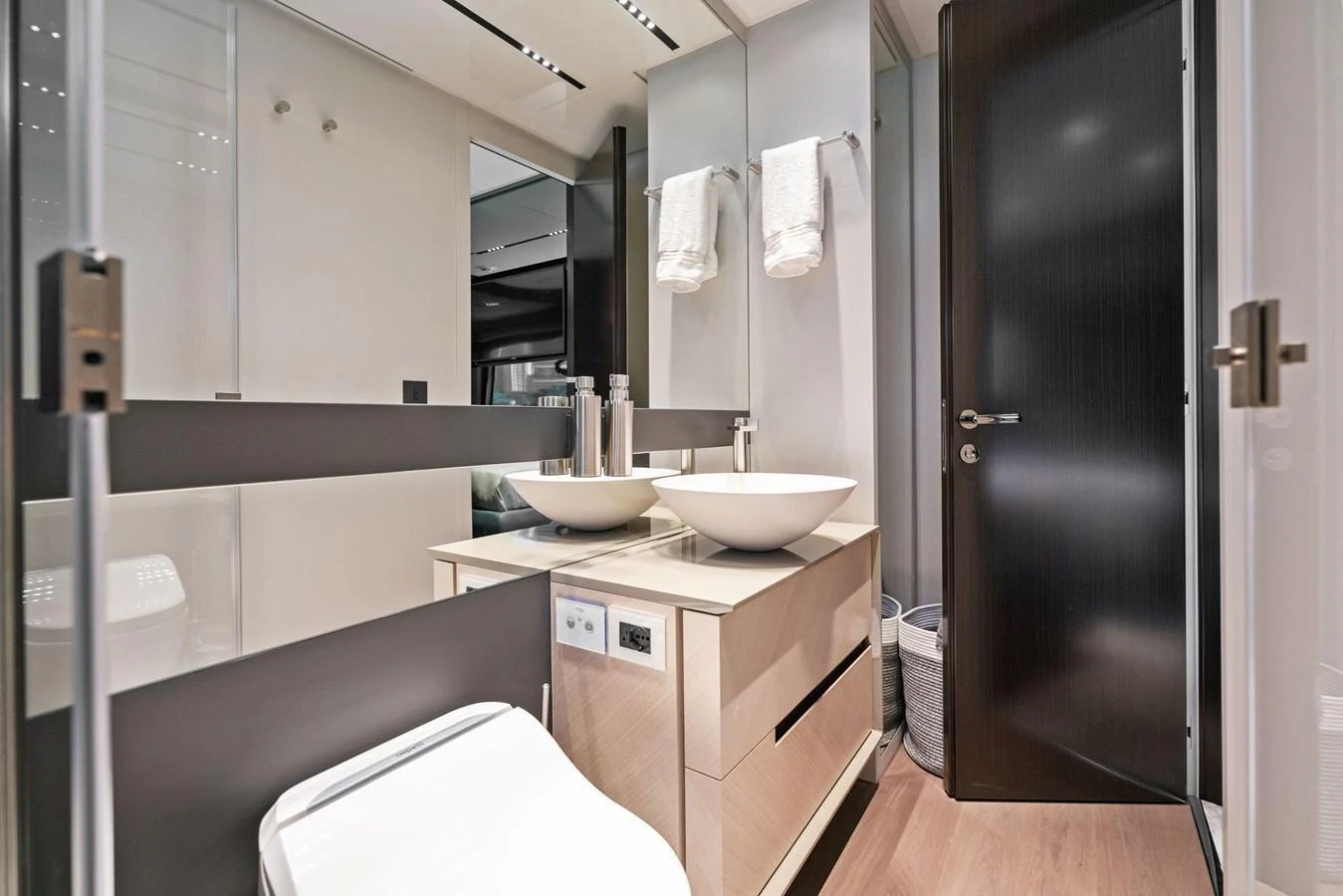 The yacht's bathroom features modern fixtures and a sleek design. aboard CAFFEINE Yacht for Sale