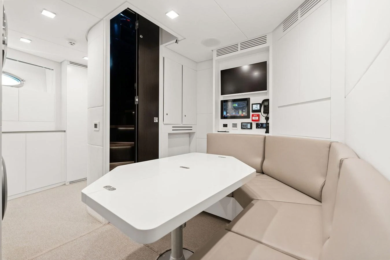 The yacht's saloon features a sleek, modern design with a comfortable seating area and integrated entertainment system. aboard CAFFEINE Yacht for Sale