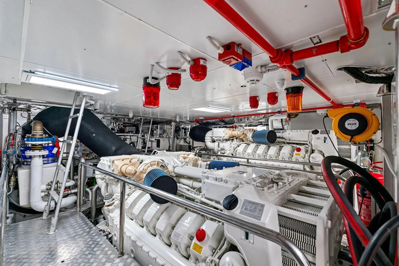 The image showcases the yacht's well-maintained engine room with advanced machinery and equipment. aboard CAFFEINE Yacht for Sale