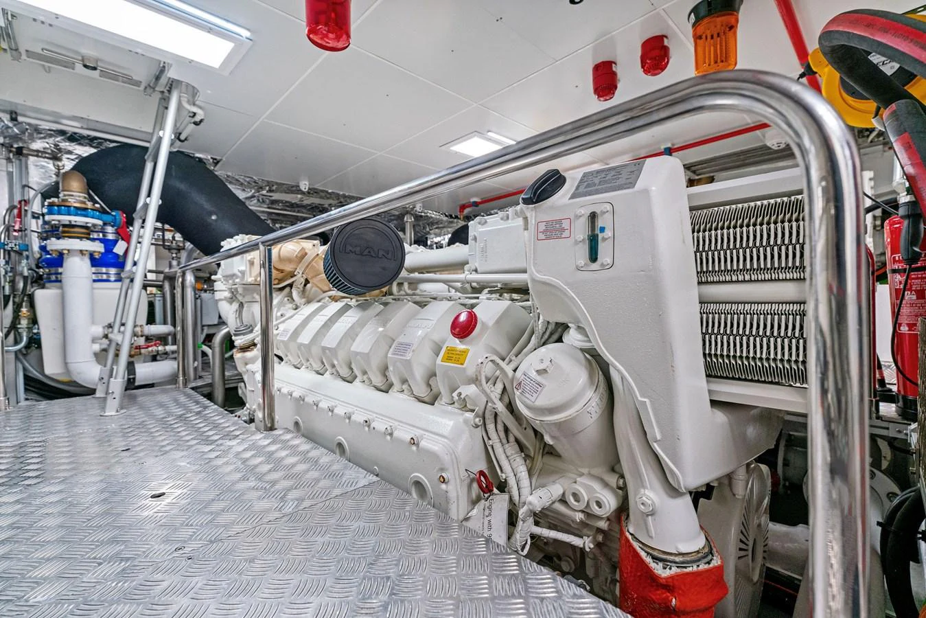 The image showcases the yacht's well-maintained engine room with advanced machinery and equipment. aboard CAFFEINE Yacht for Sale