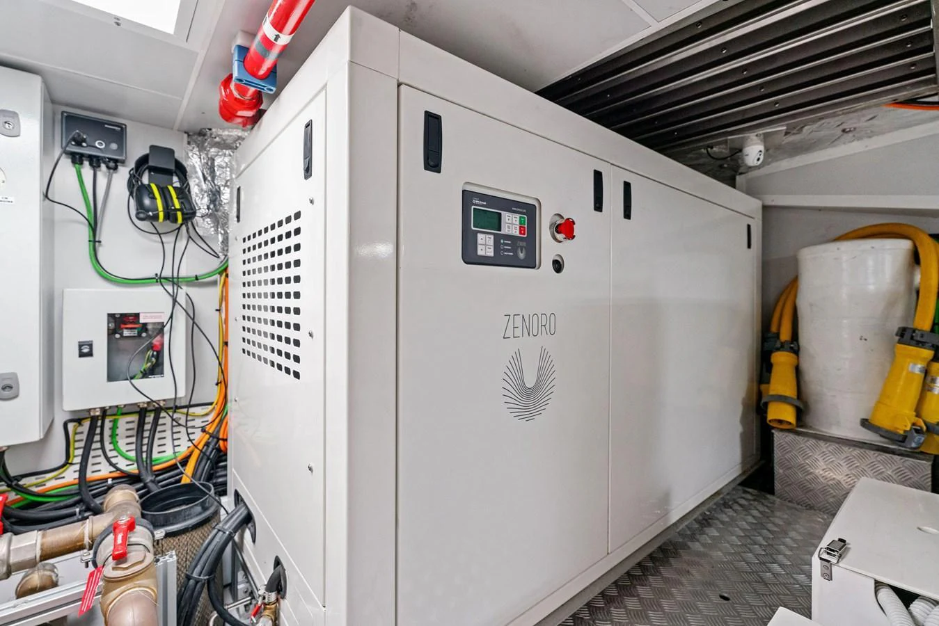 The image showcases the technical equipment and machinery within the yacht's engine room. aboard CAFFEINE Yacht for Sale