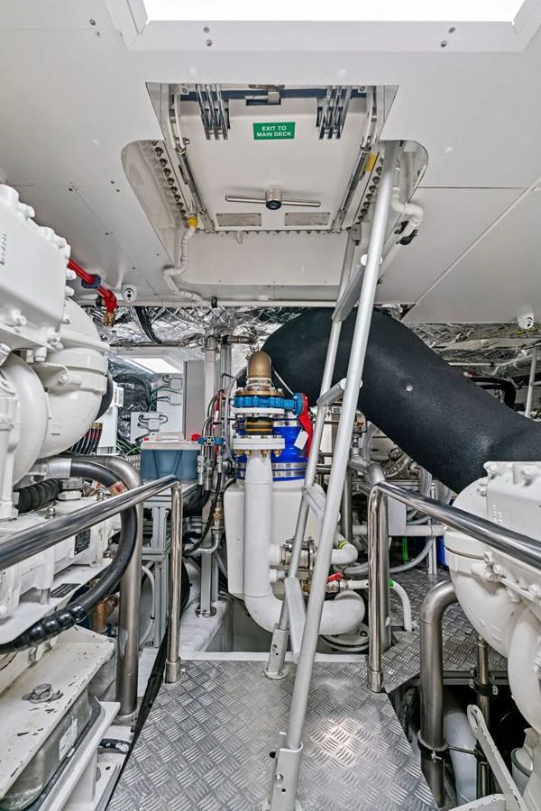 The image showcases the yacht's well-maintained engine room with advanced machinery and equipment. aboard CAFFEINE Yacht for Sale