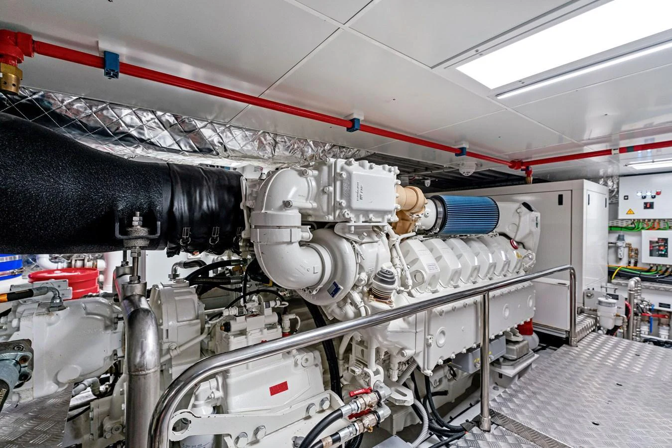 The image showcases the yacht's pristine engine room with advanced machinery and equipment. aboard CAFFEINE Yacht for Sale
