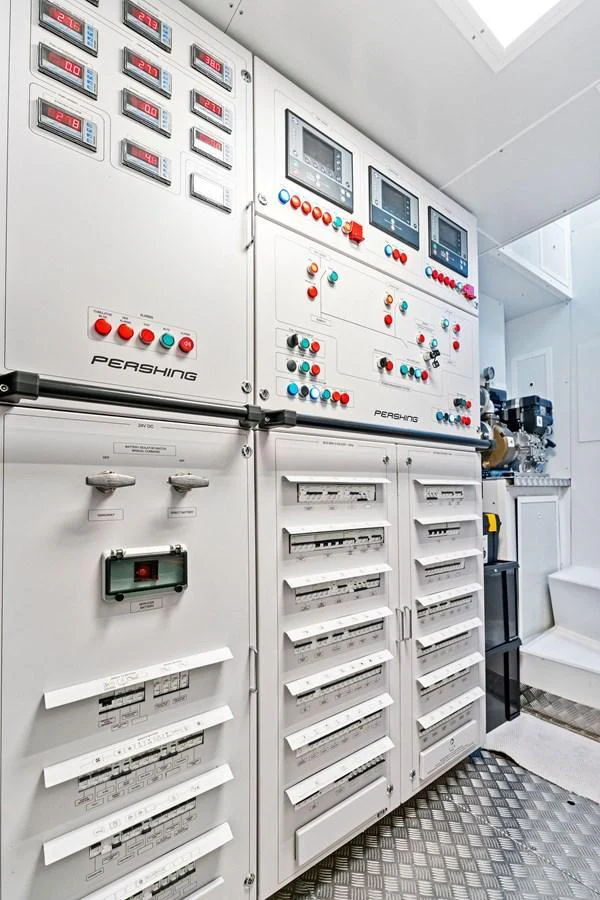 The image showcases the control panels and systems in the yacht's engine room. aboard CAFFEINE Yacht for Sale