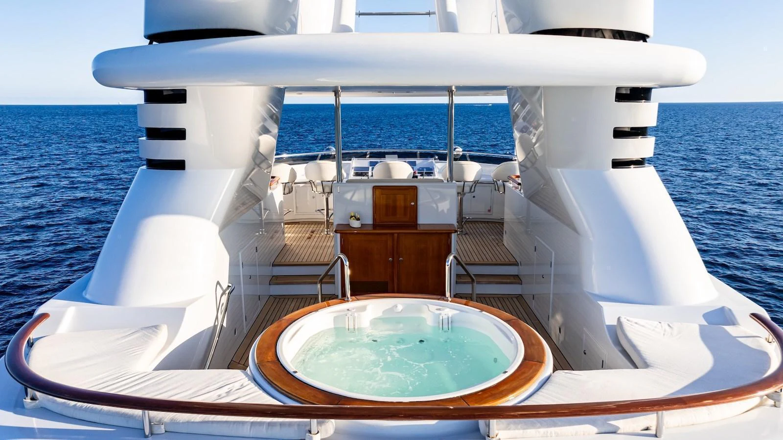 The sundeck features a luxurious jacuzzi with a stunning ocean view. aboard MYSTIQUE Yacht for Sale