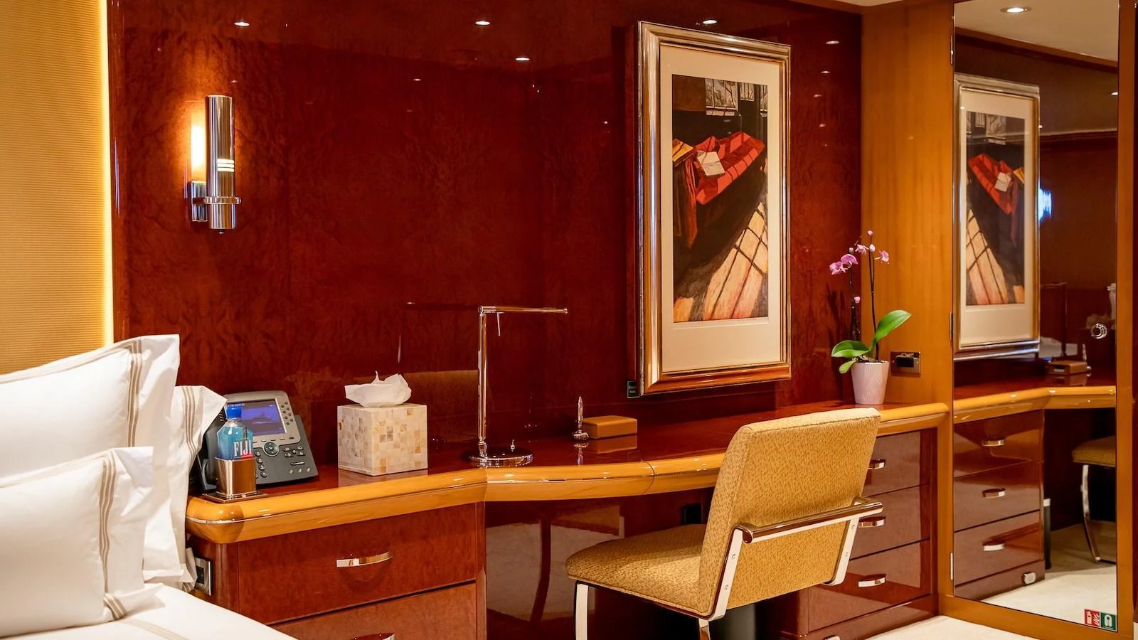 The stateroom features elegant wood paneling and comfortable furnishings. aboard MYSTIQUE Yacht for Sale