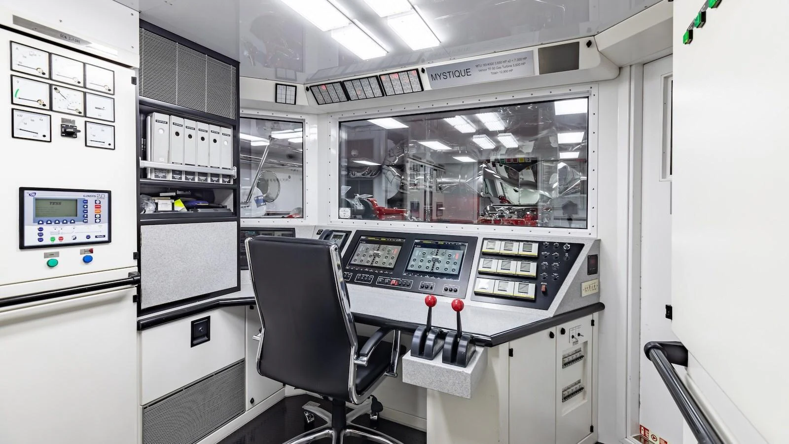 The helm station features advanced navigation and control systems for optimal yacht operation. aboard MYSTIQUE Yacht for Sale