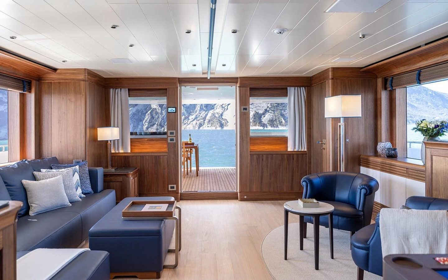 The yacht's salon offers a spacious and elegant living area with stunning views of the sea. aboard EMPIRE Yacht for Sale
