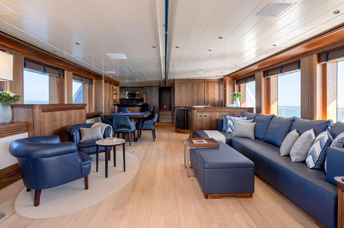 The salon features luxurious seating with a blend of modern and classic design elements. aboard EMPIRE Yacht for Sale