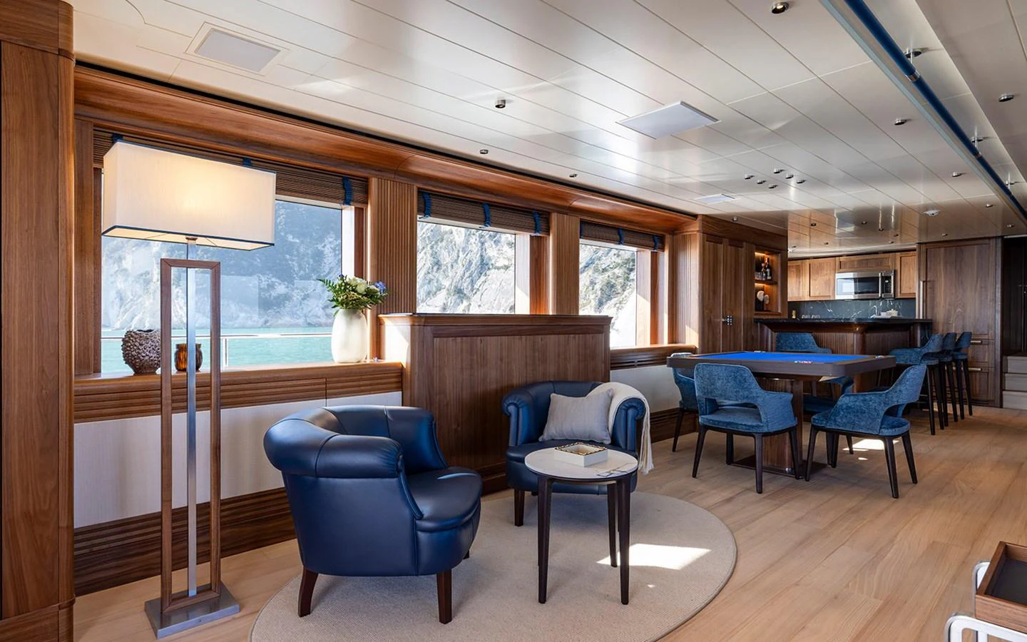 The yacht's salon features elegant seating with a mix of modern and classic design elements, offering a comfortable and stylish space for relaxation. aboard EMPIRE Yacht for Sale