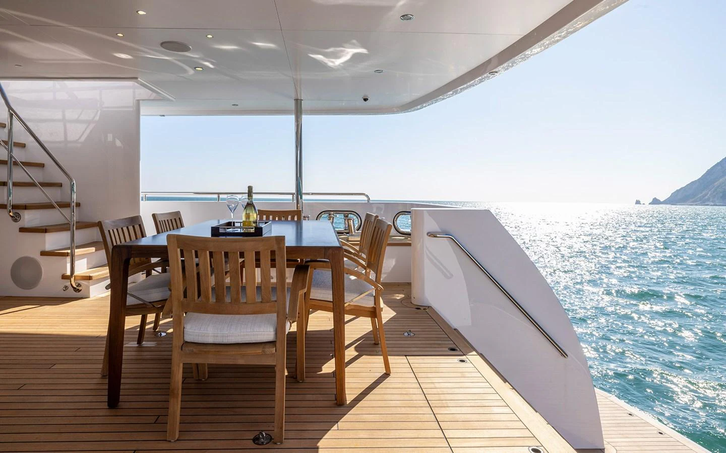 The aft deck offers a serene dining area with stunning ocean views. aboard EMPIRE Yacht for Sale