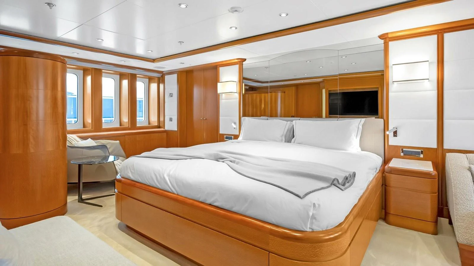 a room with a bed and a desk aboard UNFORGETTABLE Yacht for Sale