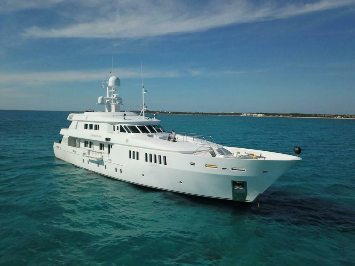 a white boat in the water aboard UNFORGETTABLE Yacht for Sale