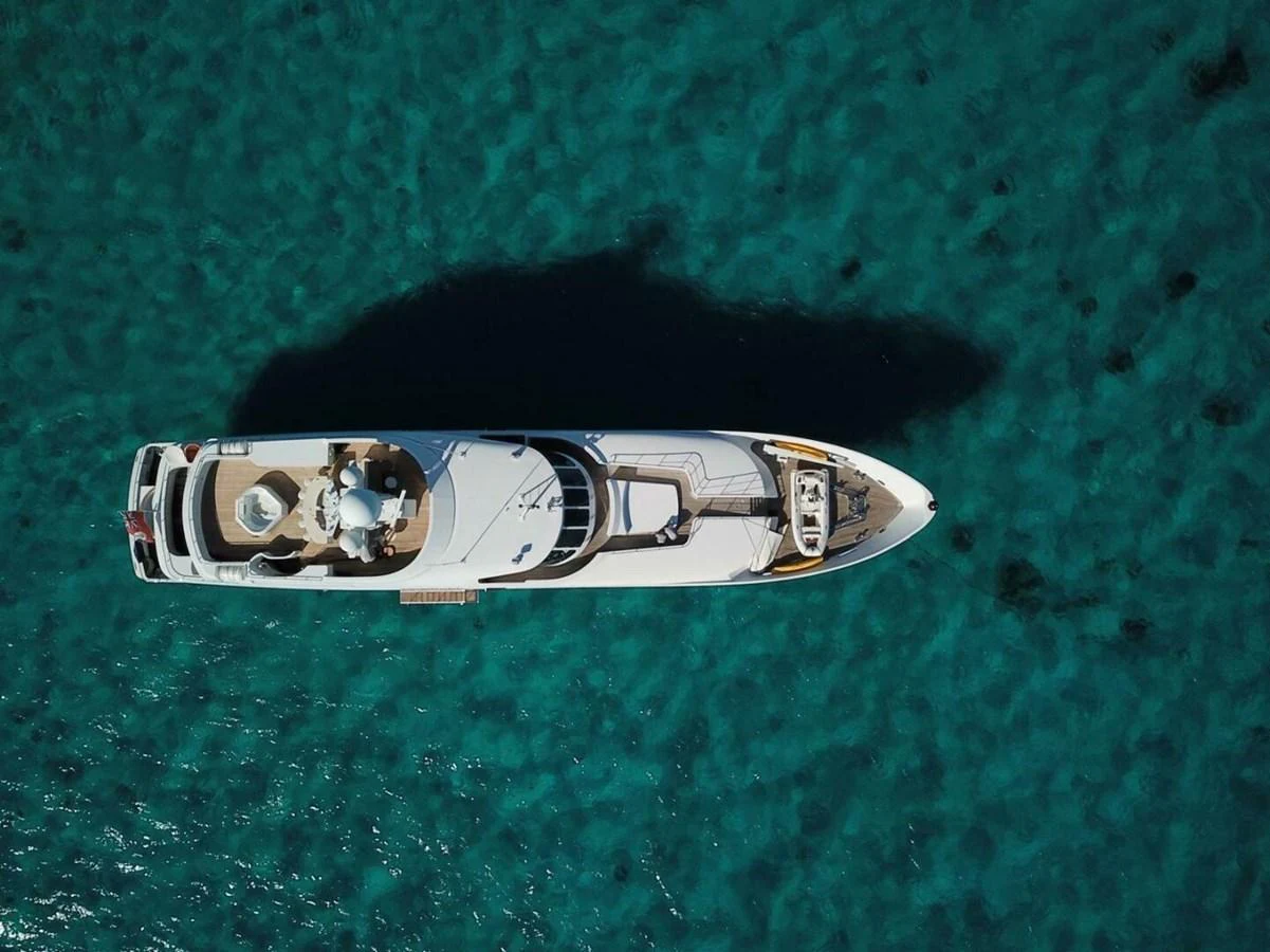 a silver and gold ring on a green surface aboard UNFORGETTABLE Yacht for Sale