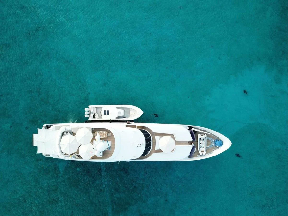 a white boat in the water aboard UNFORGETTABLE Yacht for Sale