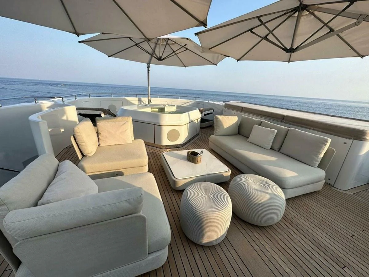 a boat with a table and chairs aboard UNFORGETTABLE Yacht for Sale