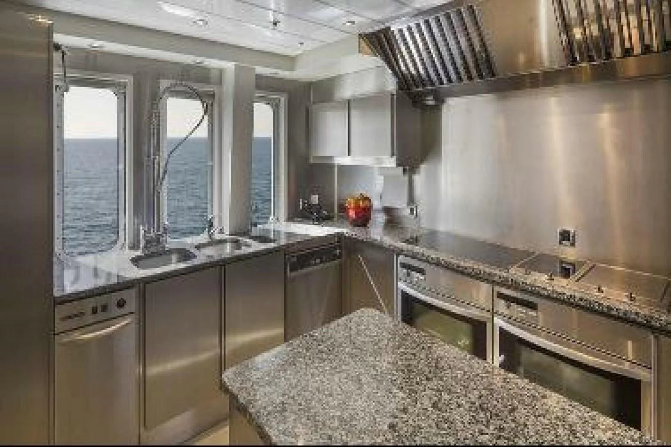 a kitchen with a large island aboard UNFORGETTABLE Yacht for Sale