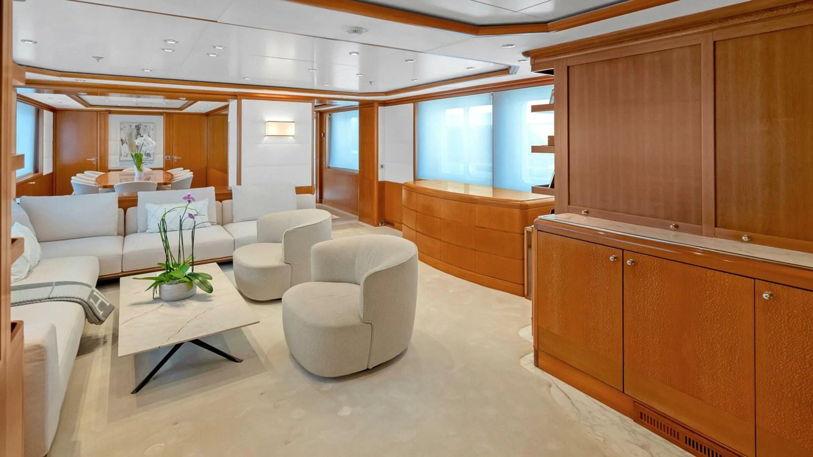 a room with a couch and a table aboard UNFORGETTABLE Yacht for Sale