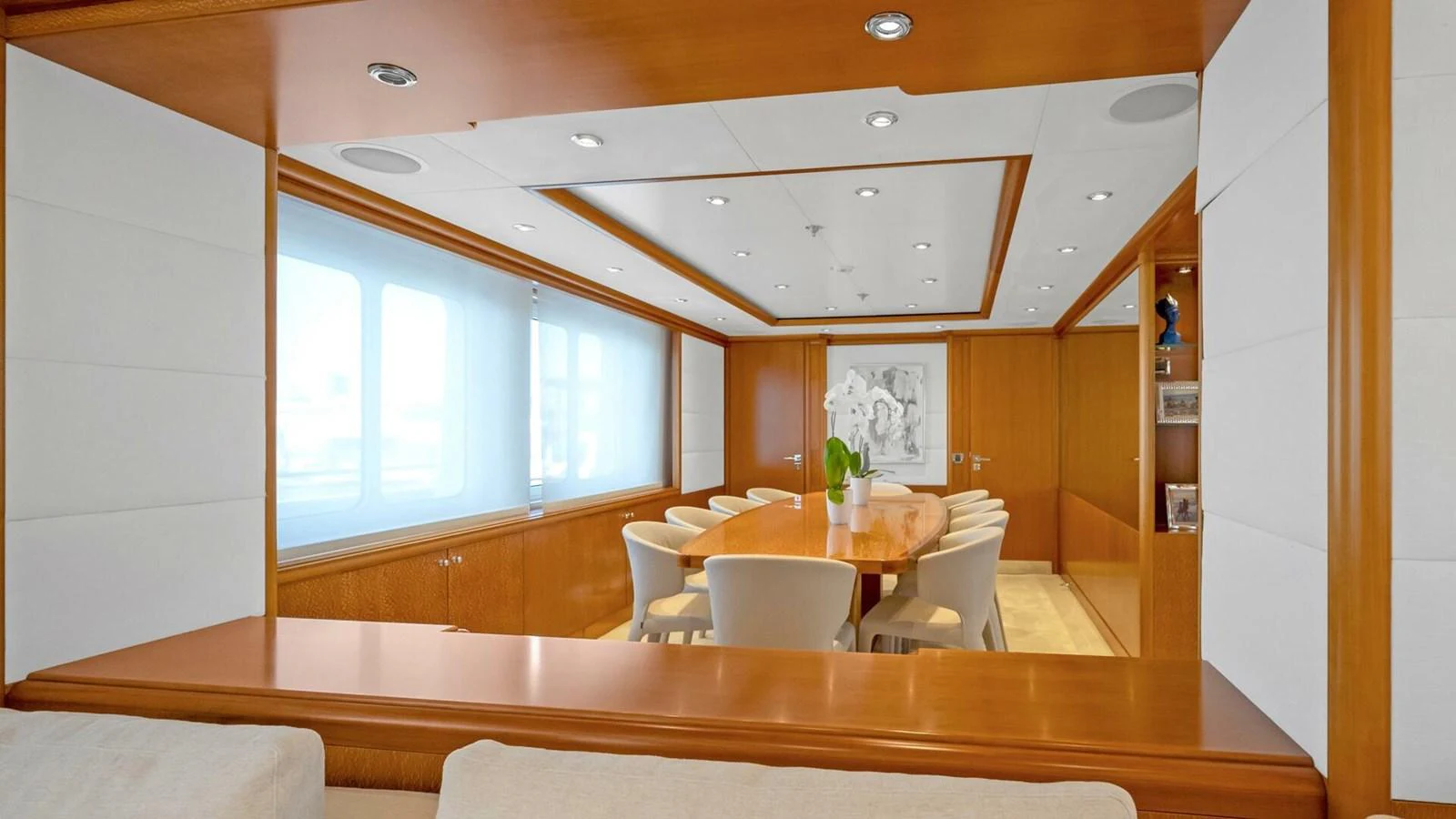 a room with a table and chairs aboard UNFORGETTABLE Yacht for Sale