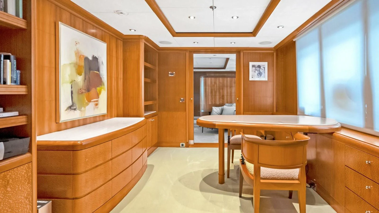 a room with a table and chairs aboard UNFORGETTABLE Yacht for Sale