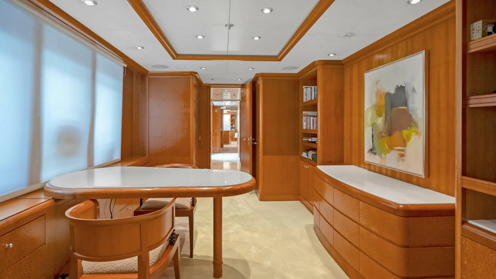 a room with a table and chairs aboard UNFORGETTABLE Yacht for Sale