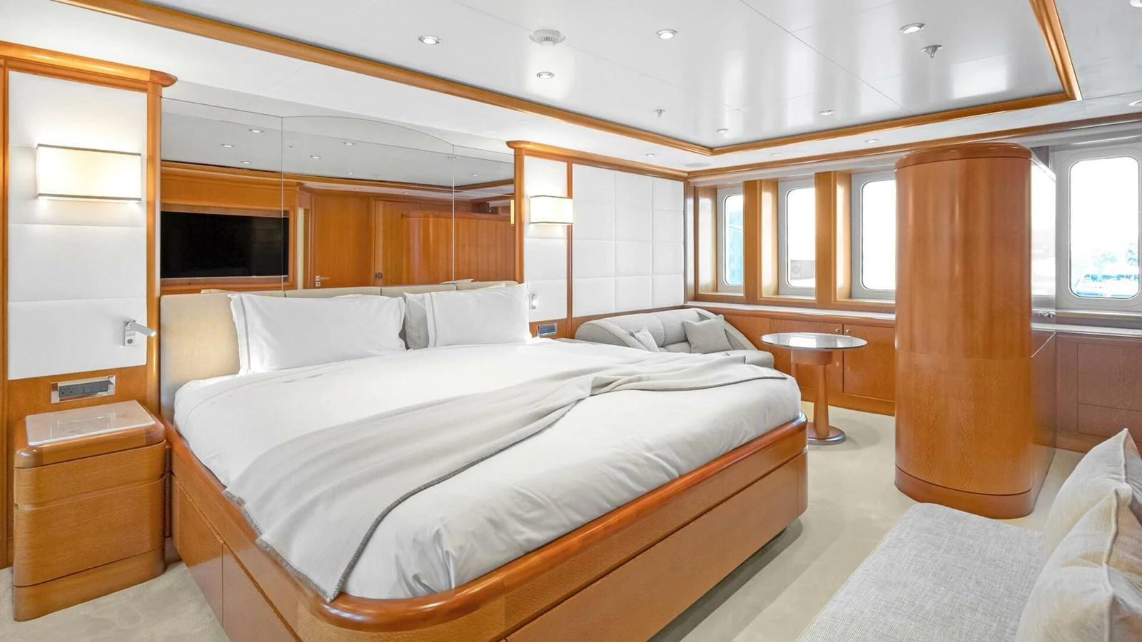 a room with a bed and a table aboard UNFORGETTABLE Yacht for Sale