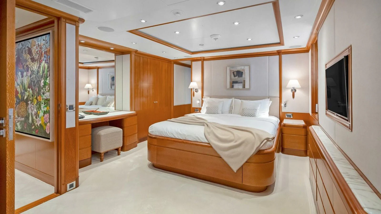 a bedroom with a large bed aboard UNFORGETTABLE Yacht for Sale