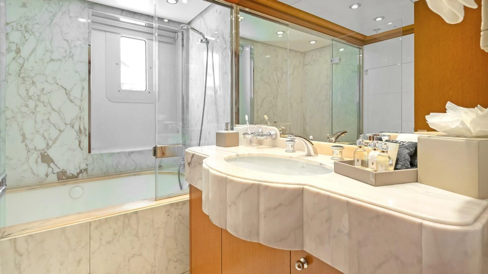 a bathroom with a large mirror aboard UNFORGETTABLE Yacht for Sale