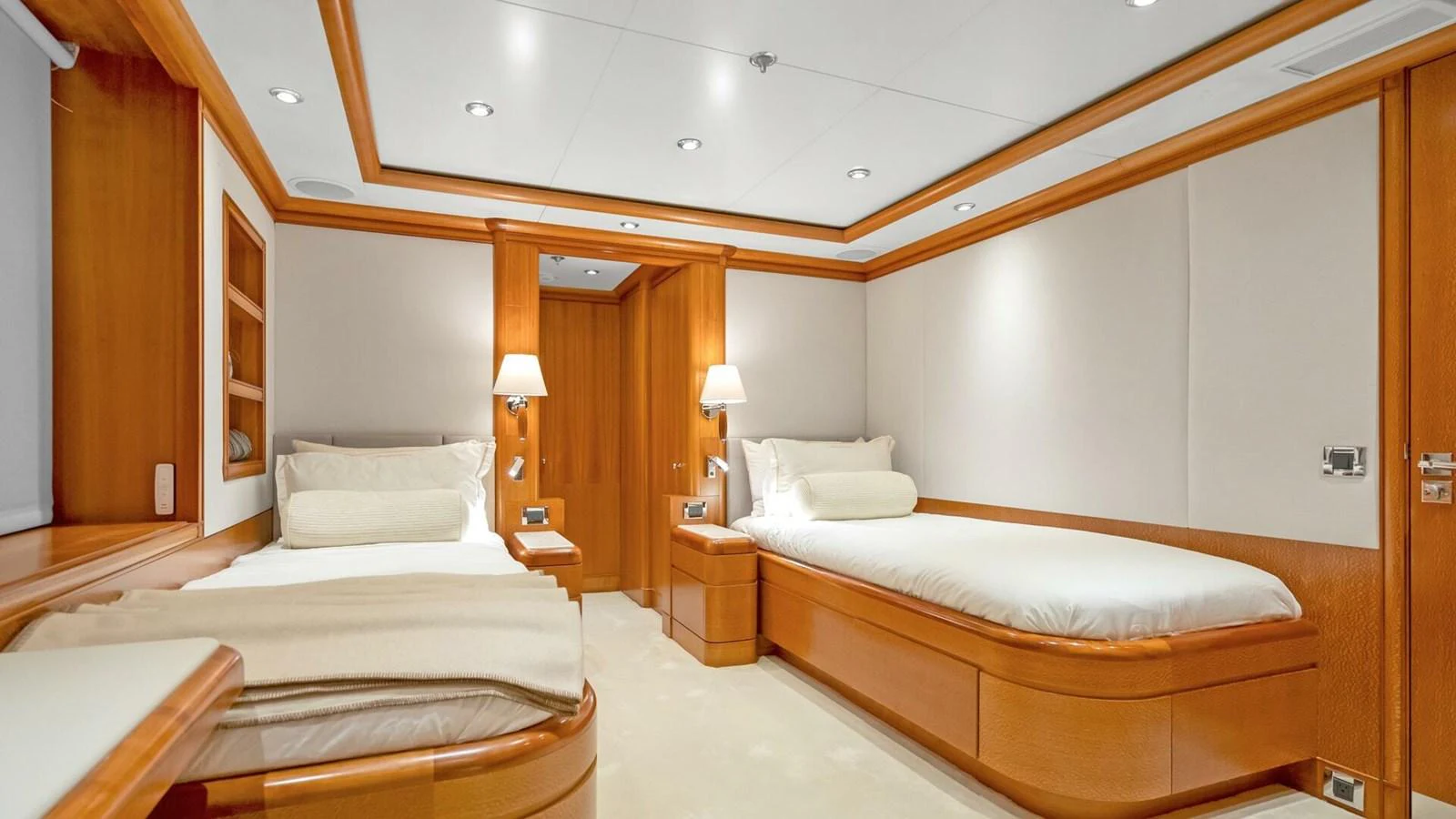 a room with a couple of beds aboard UNFORGETTABLE Yacht for Sale