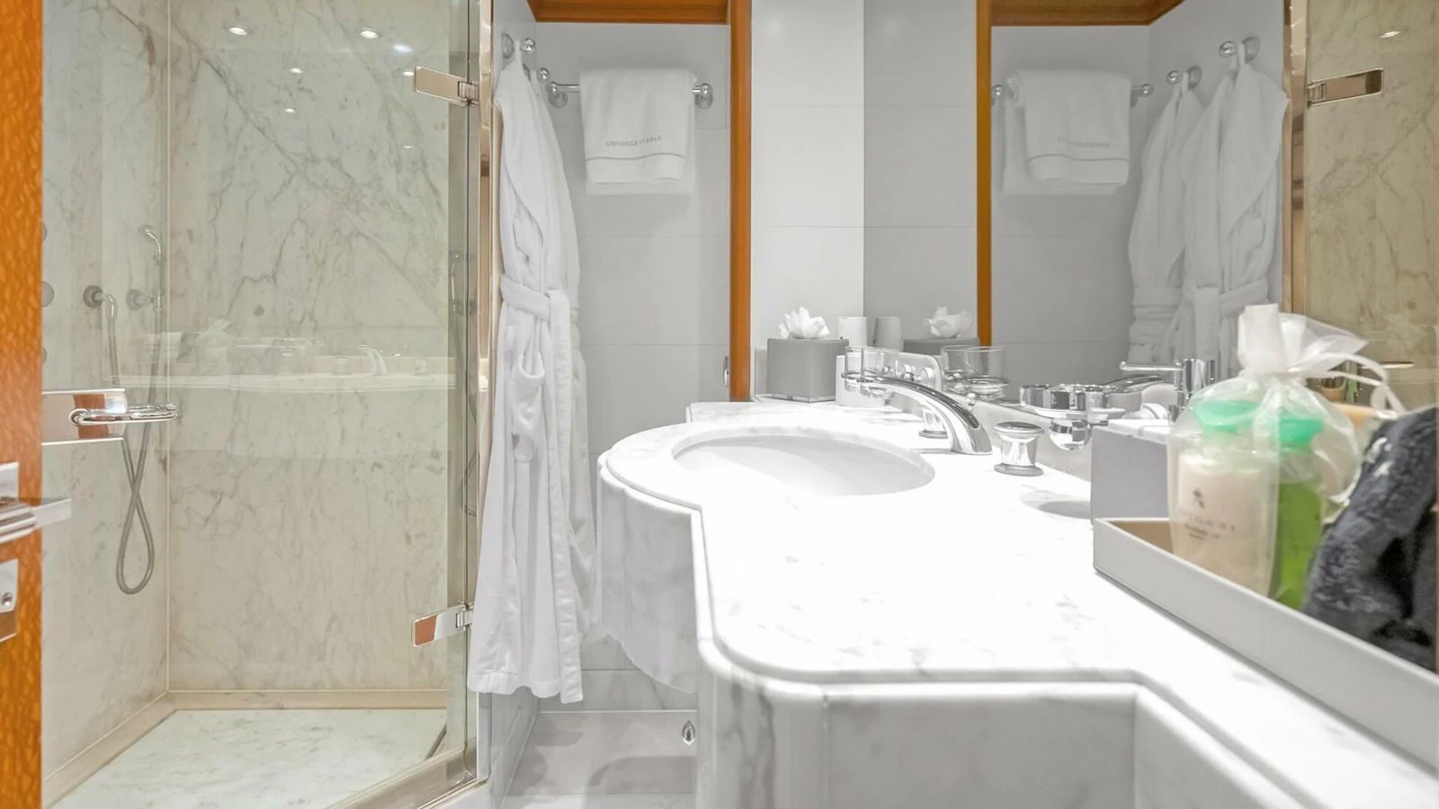 a bathroom with a sink and a mirror aboard UNFORGETTABLE Yacht for Sale