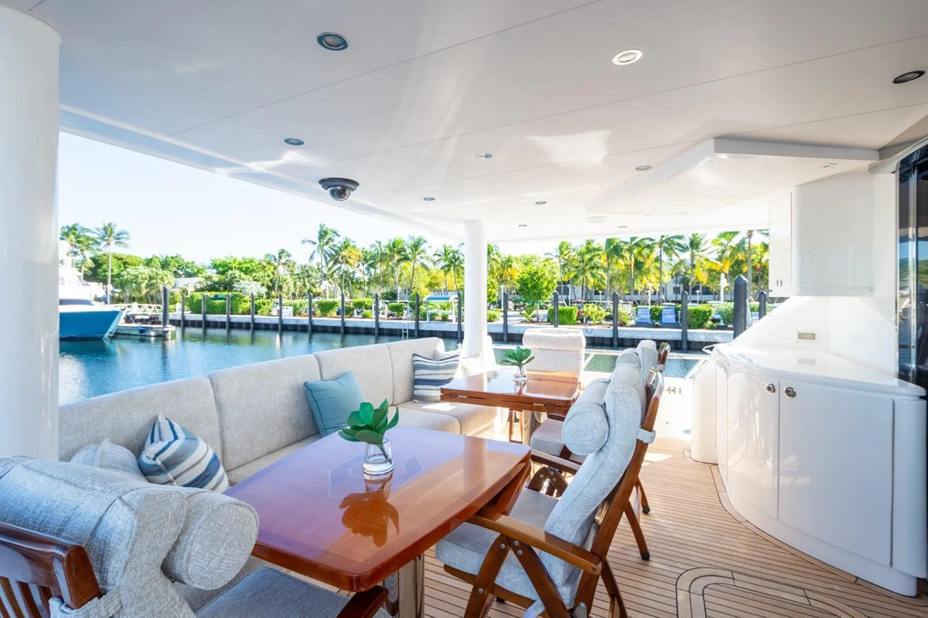 The aft deck offers a spacious and inviting outdoor dining area with comfortable seating and scenic views. aboard LUCKY PENNY Yacht for Sale