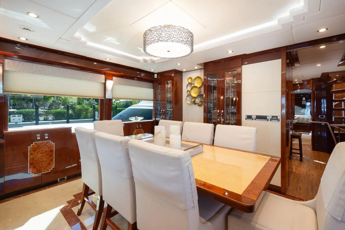 The yacht's dining area features a luxurious table with plush seating and elegant decor. aboard LUCKY PENNY Yacht for Sale