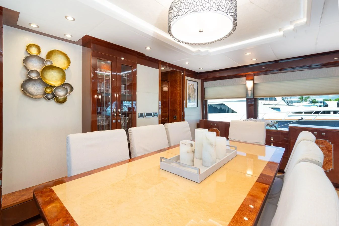 The yacht's dining area features a luxurious table with elegant seating and modern decor. aboard LUCKY PENNY Yacht for Sale