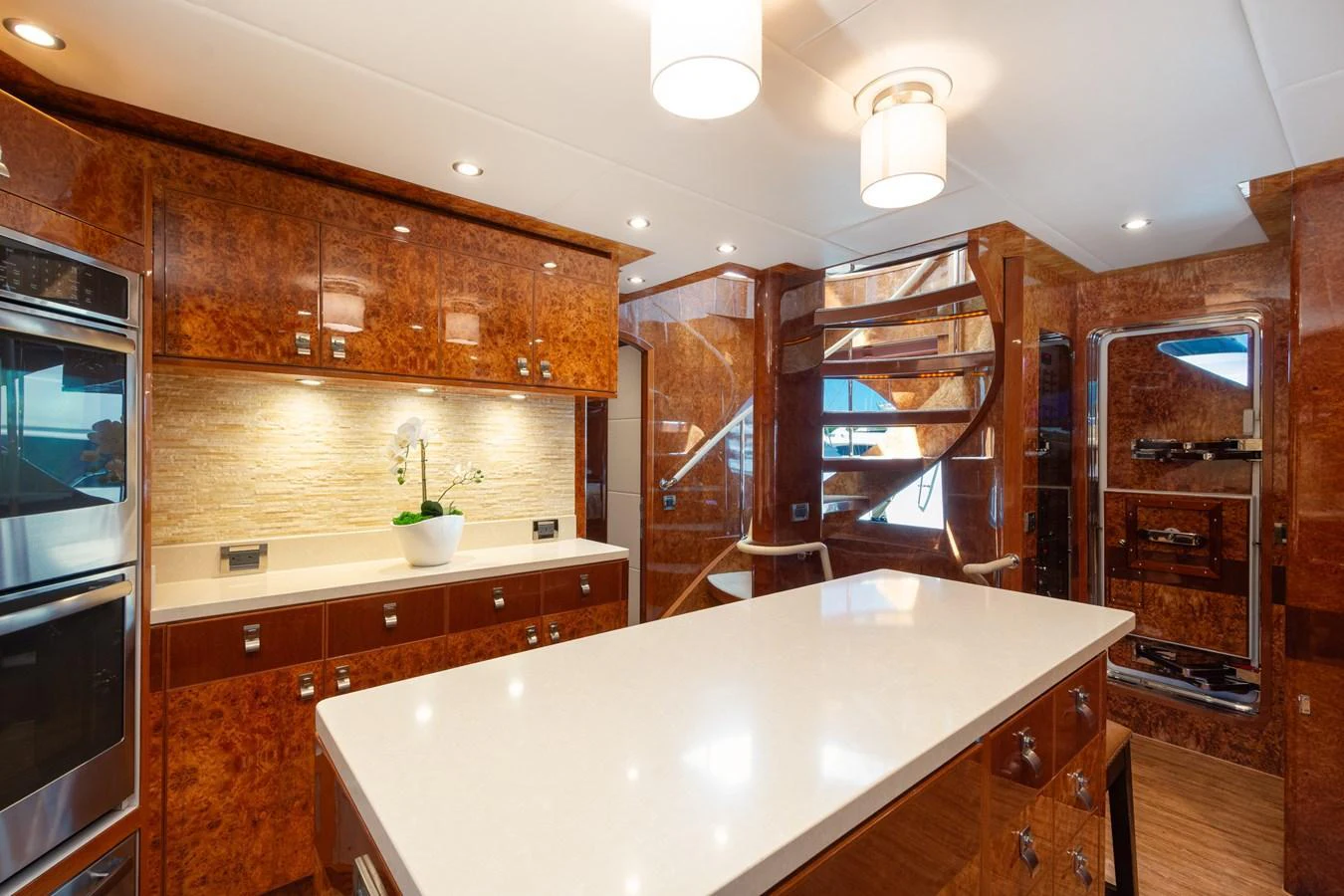 The yacht's galley features luxurious wood finishes and modern appliances. aboard LUCKY PENNY Yacht for Sale