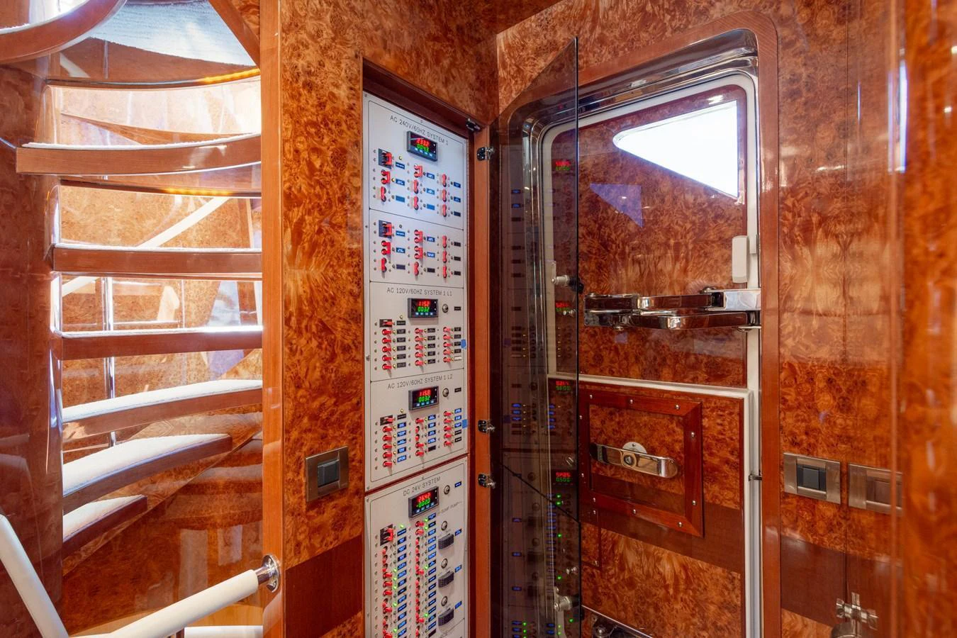 The yacht's engine room showcases a sophisticated control panel with intricate systems and polished wood finishes. aboard LUCKY PENNY Yacht for Sale