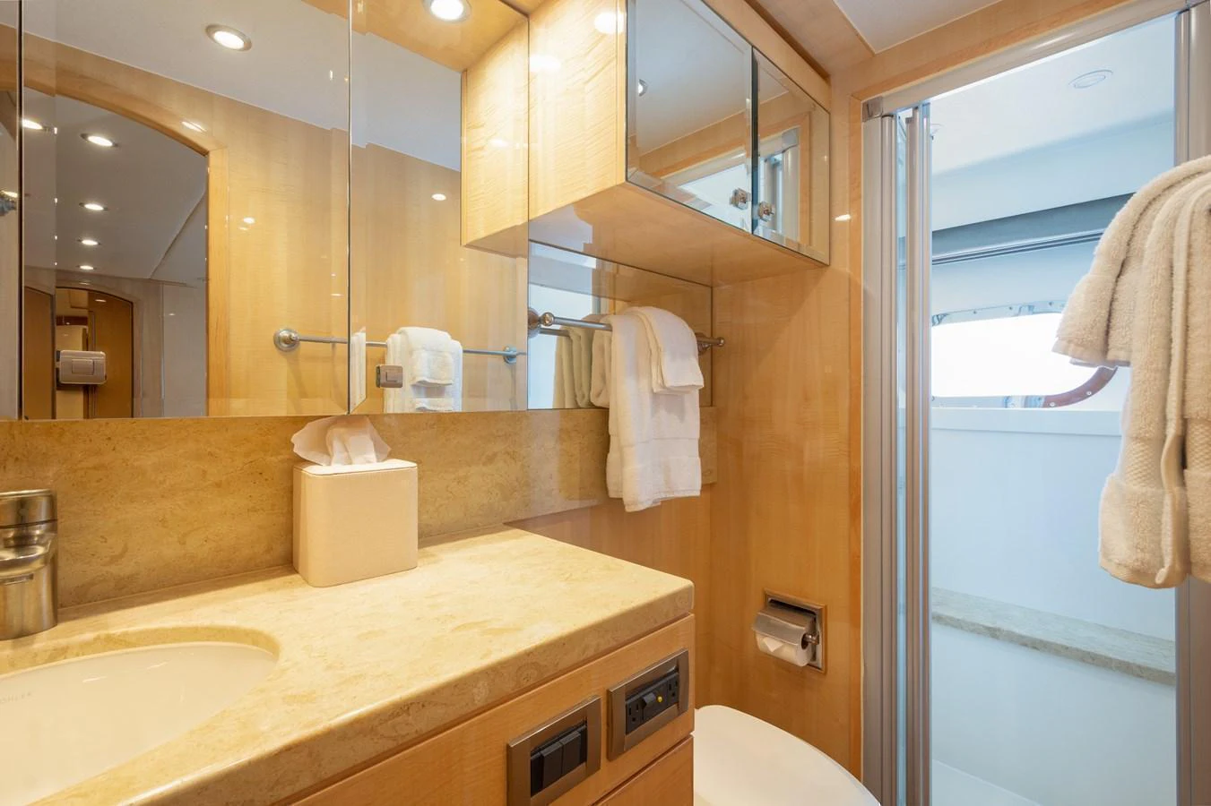A well-appointed yacht bathroom with modern fixtures and ample lighting. aboard LUCKY PENNY Yacht for Sale