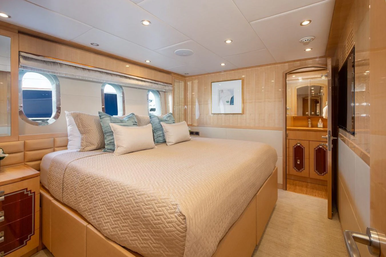 The master stateroom features a spacious bed with elegant decor and ample natural light. aboard LUCKY PENNY Yacht for Sale