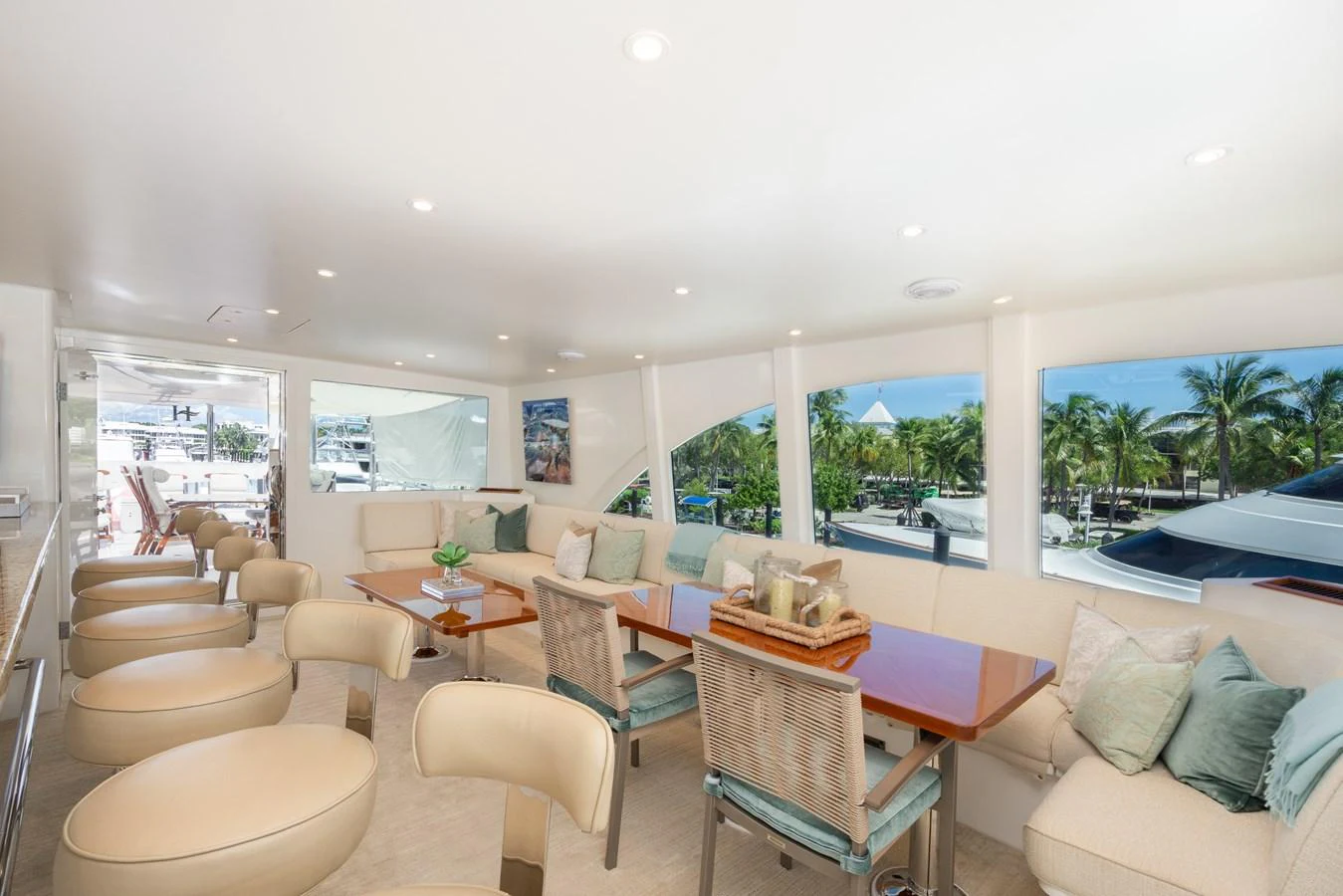 The salon offers a spacious and bright seating area with large windows providing a scenic view. aboard LUCKY PENNY Yacht for Sale