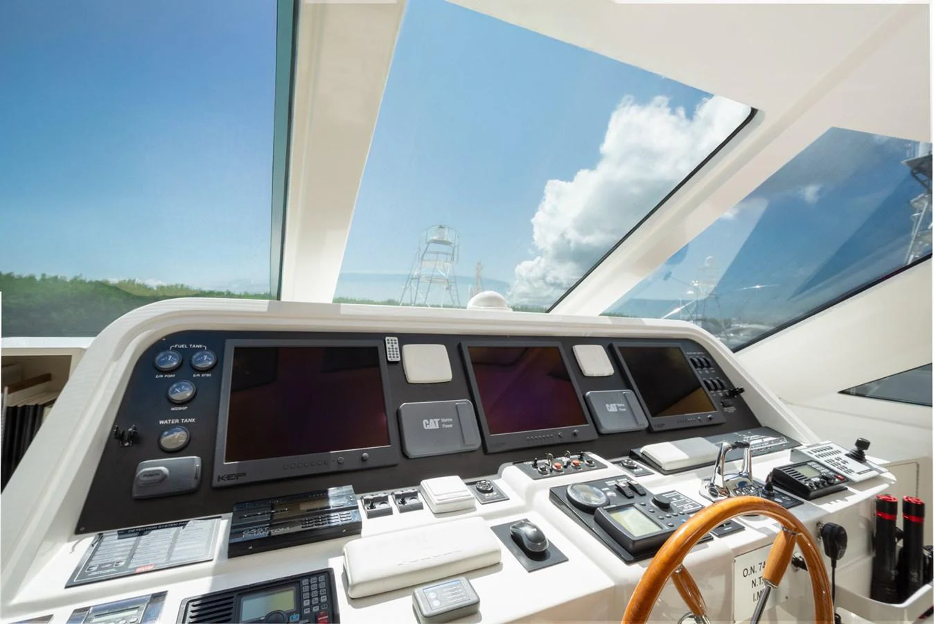 The helm station features advanced navigation equipment and offers a panoramic view through large windows. aboard LUCKY PENNY Yacht for Sale