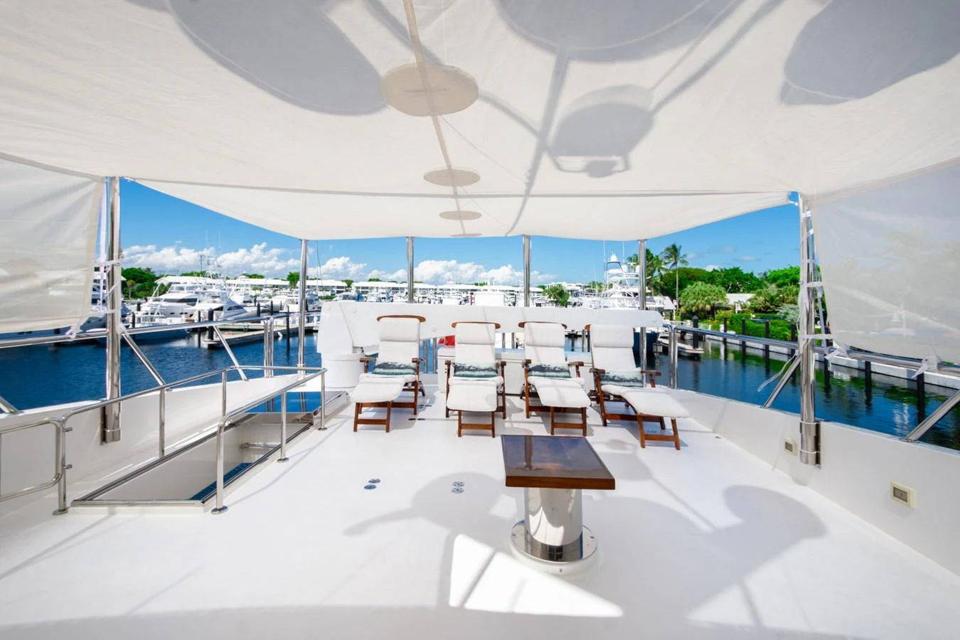 The sundeck offers a spacious and inviting area for relaxation with ample seating and stunning views. aboard LUCKY PENNY Yacht for Sale