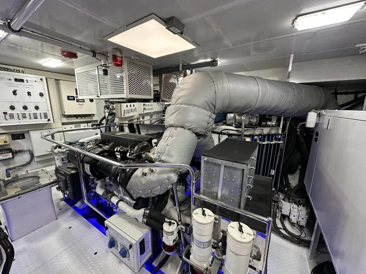 The image showcases the yacht's well-maintained engine room with advanced machinery and equipment. aboard LUCKY PENNY Yacht for Sale