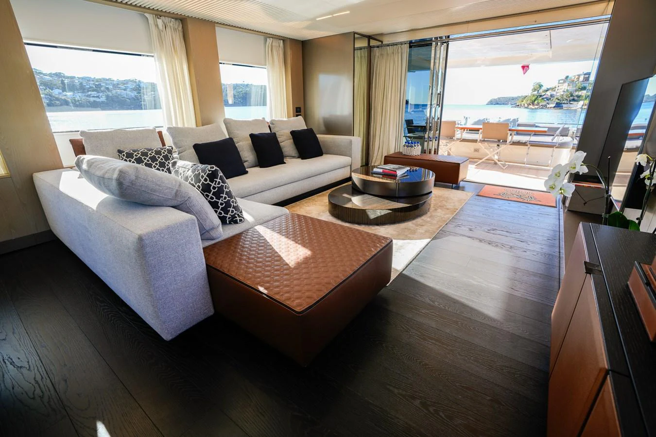 a living room with a large window aboard TORO Yacht for Sale