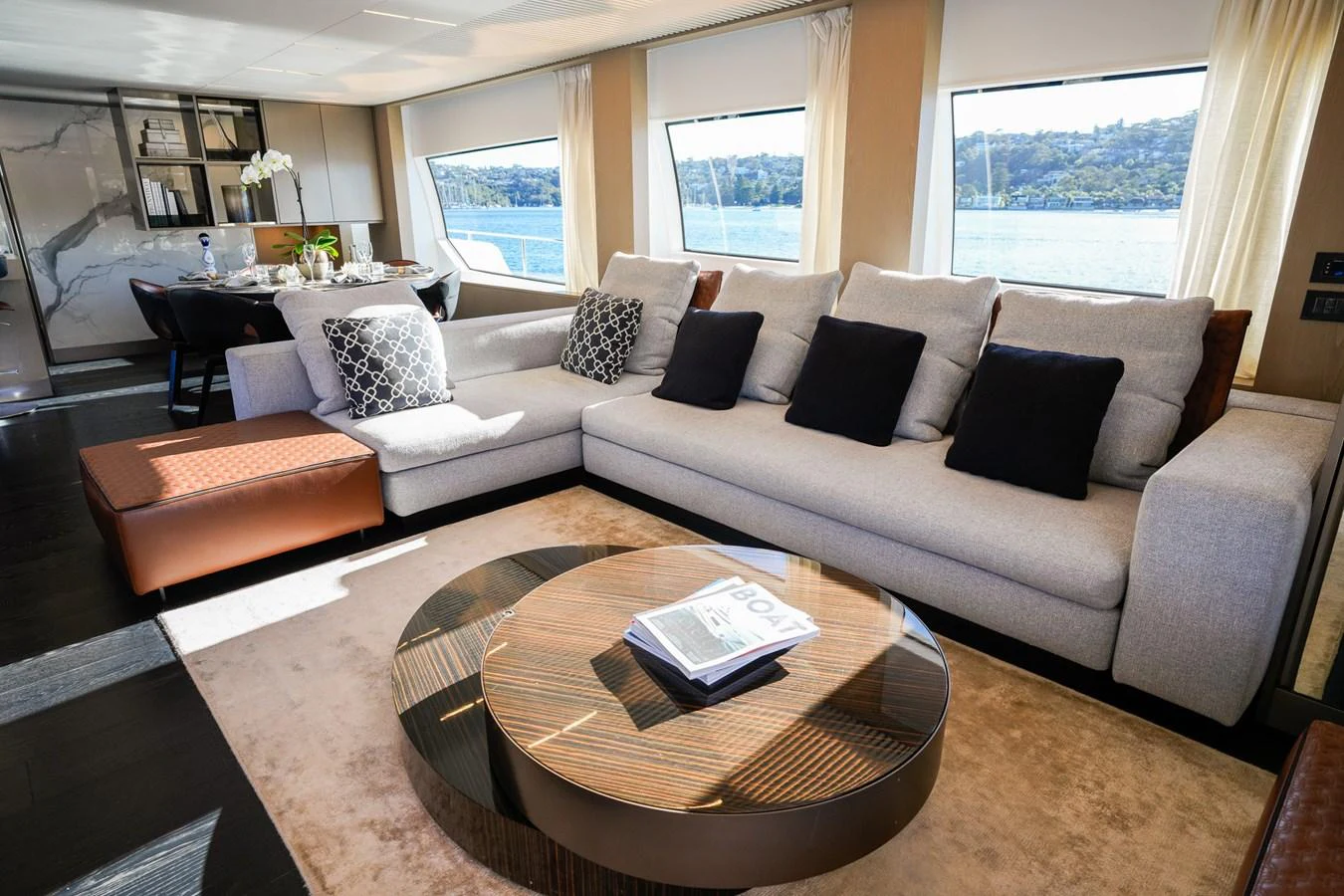 a living room with a couch and coffee table aboard TORO Yacht for Sale