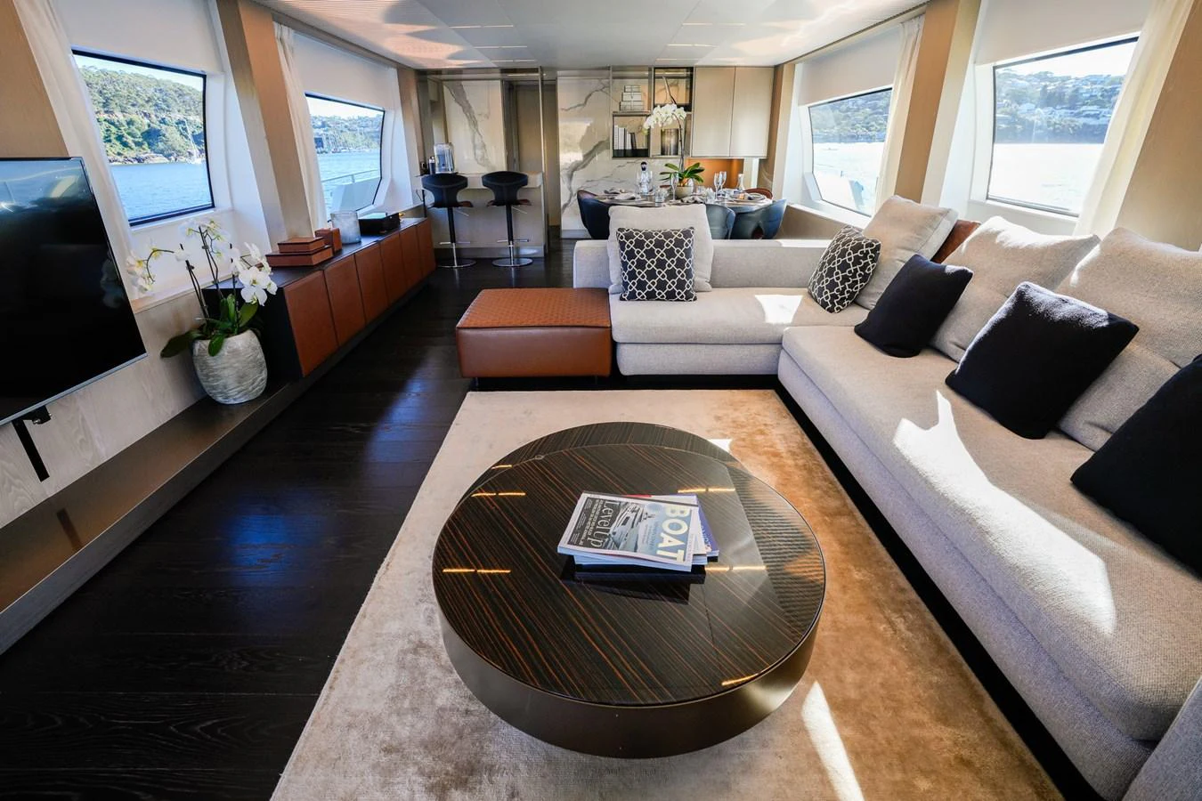 a living room with a large sofa aboard TORO Yacht for Sale