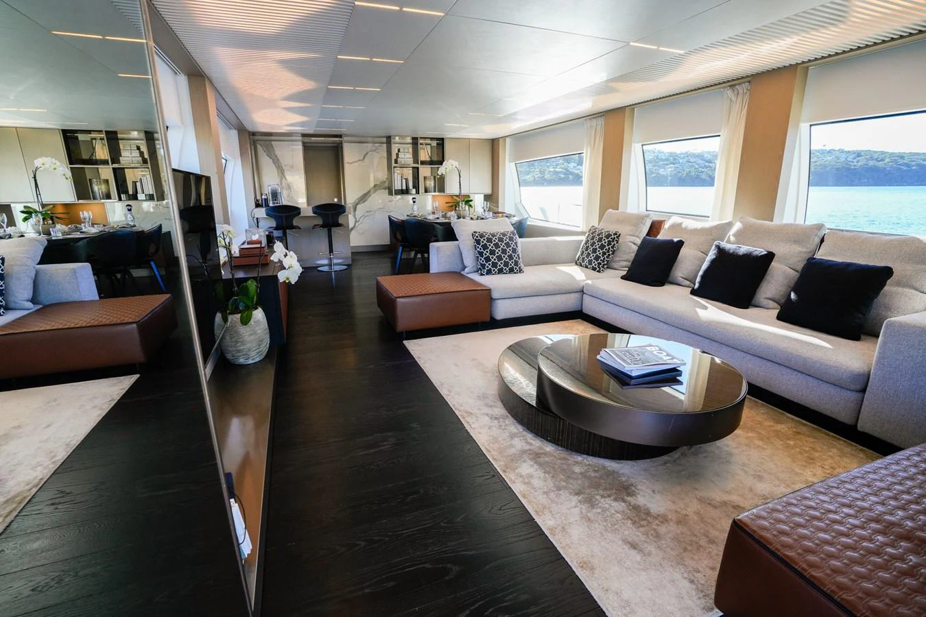a living room with a large window aboard TORO Yacht for Sale