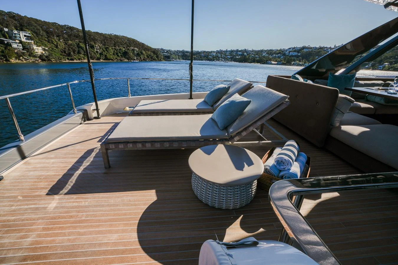 a deck with a chair and a pool on it aboard TORO Yacht for Sale