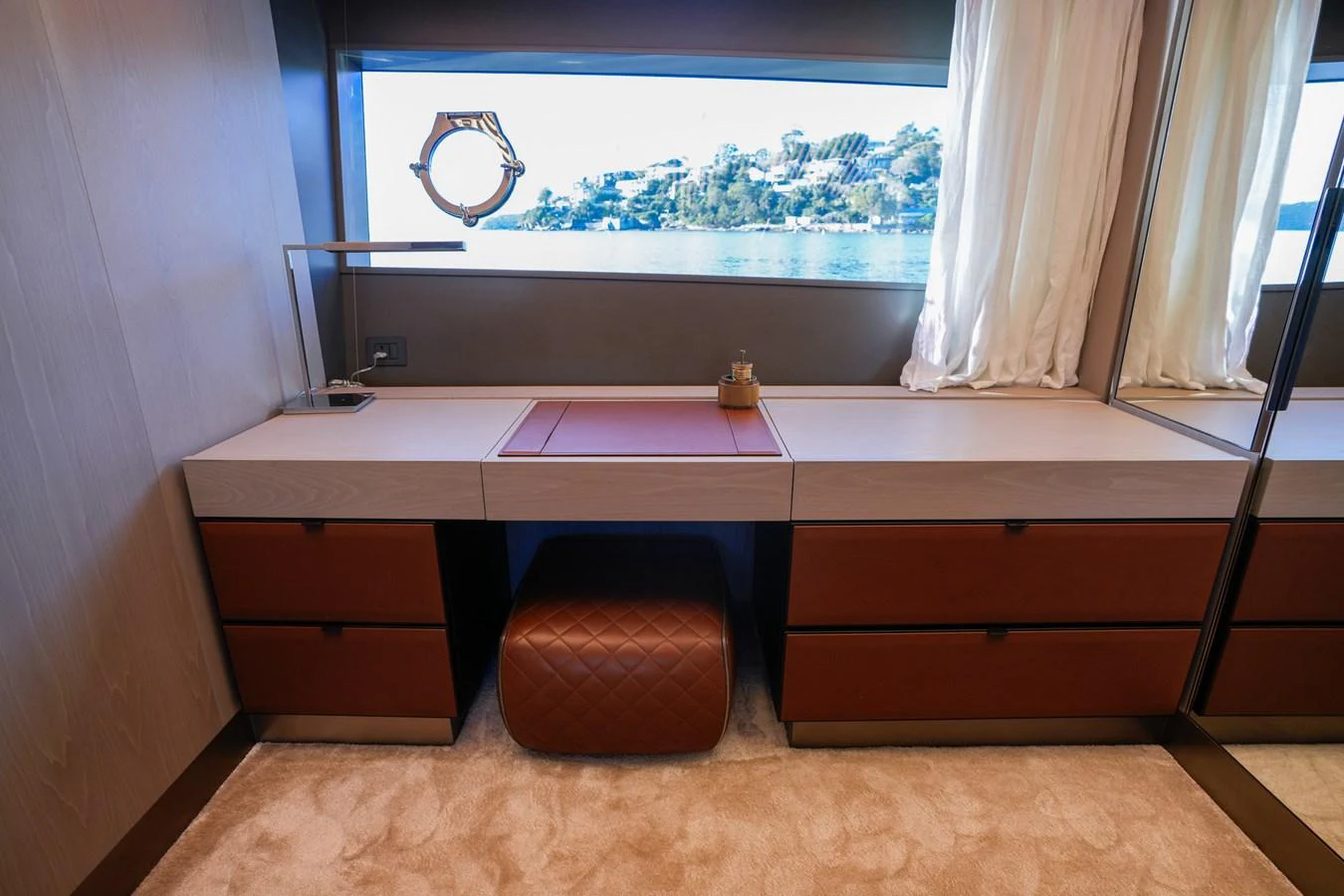 a desk with a window and a window aboard TORO Yacht for Sale
