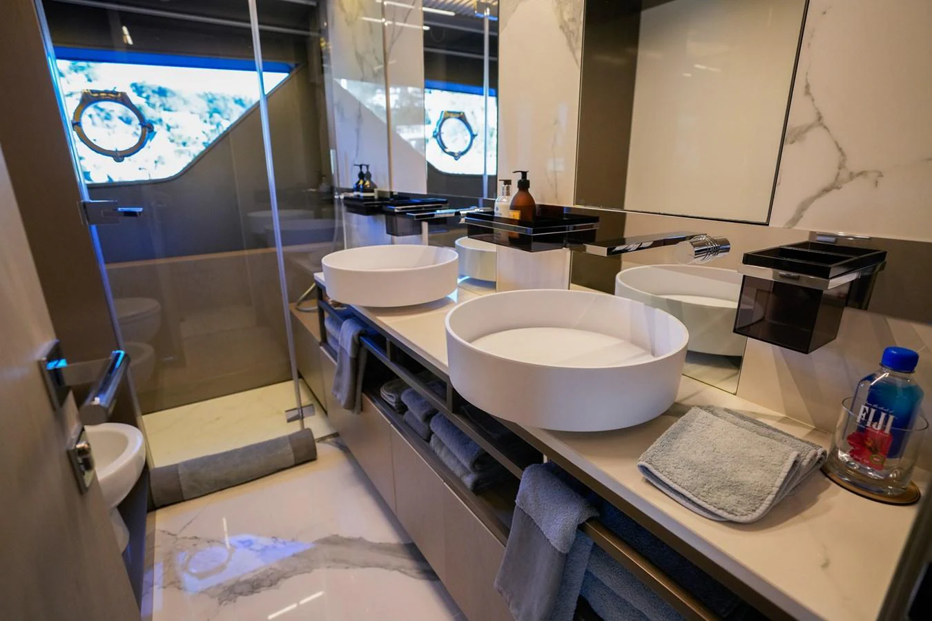 a bathroom with a sink and a mirror aboard TORO Yacht for Sale
