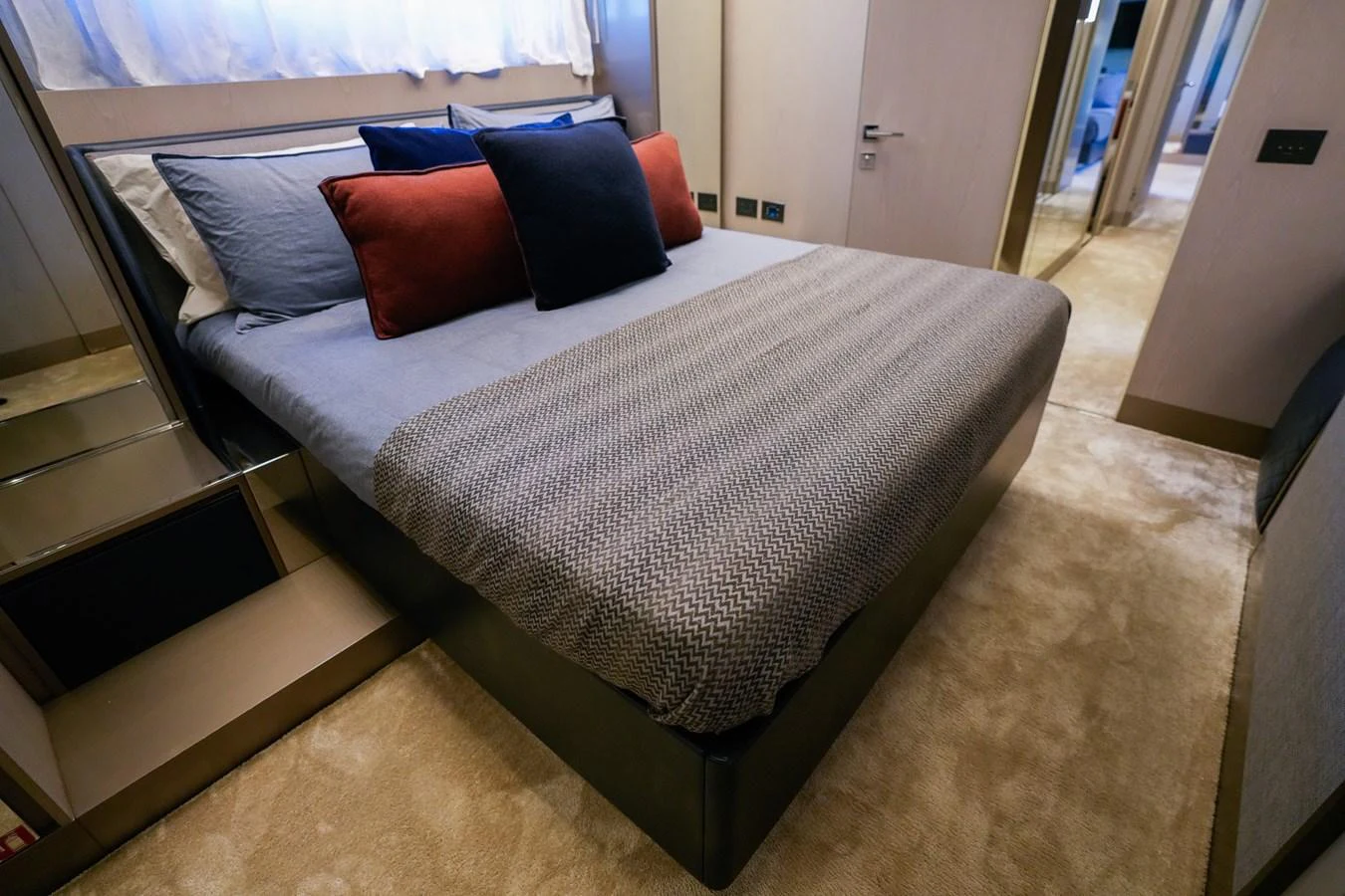 a bed with a white sheet aboard TORO Yacht for Sale